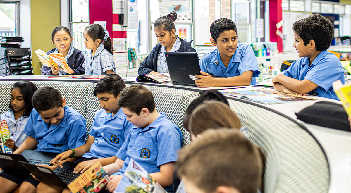 Children sit in circle at Our Lady of the Rosary Catholic Primary School St Marys