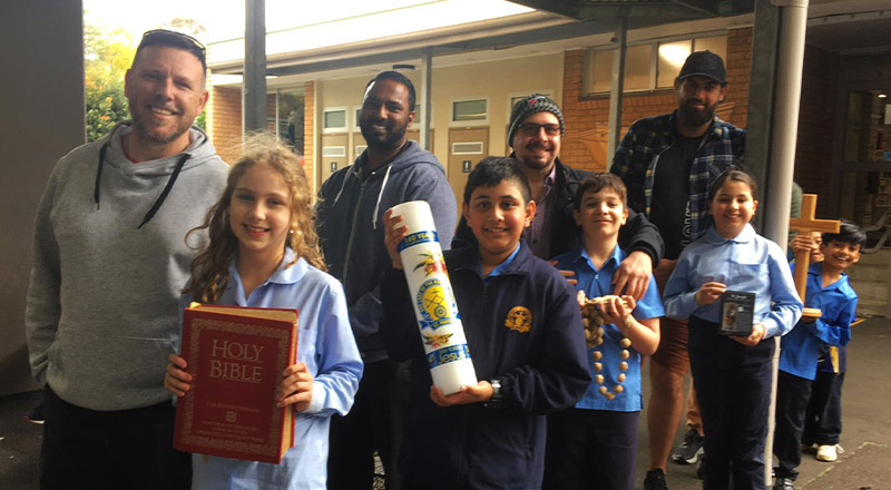 Children and parents preparing for gospel procession at Our Lady of the Rosary Catholic Primary School St Marys