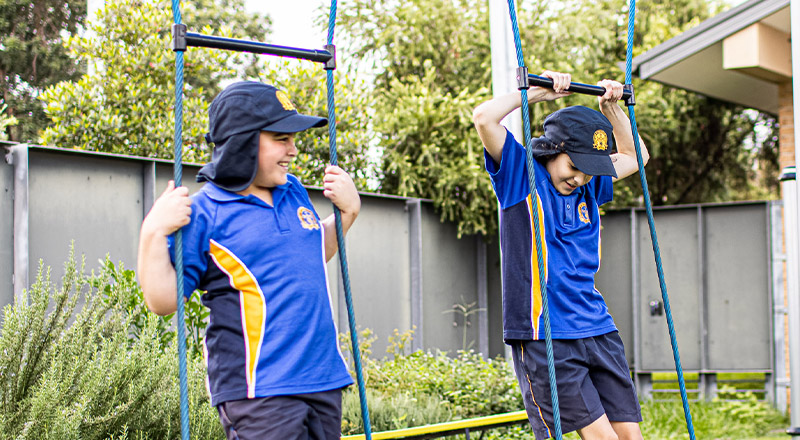 Children on play equipment at Our Lady of the Rosary Catholic Primary School St Marys