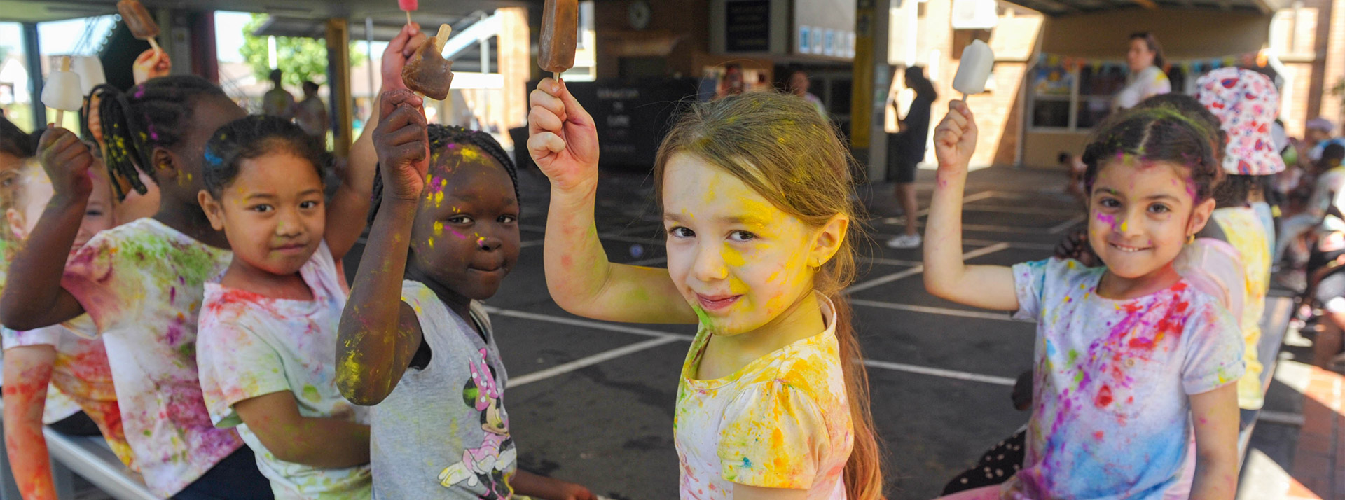 Students eating iceblocks after participating in a fun run at Our Lady of the Rosary Catholic Primary School St MarysOur Lady of the Rosary Catholic Primary School St Marys