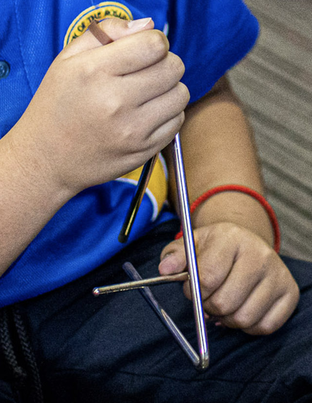 Student playing percussion instrument at Our Lady of the Rosary Catholic Primary School St Marys