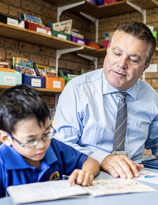 Principal Michael Siciliano and student from Our Lady of the Rosary Catholic Primary School St Marys