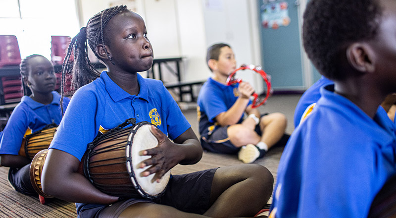 Student playing percussion instrument at Our Lady of the Rosary Catholic Primary School St Marys
