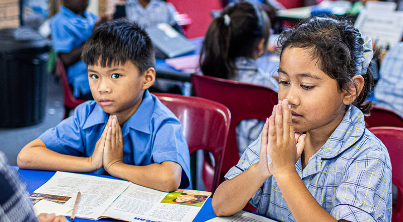 Students praying at Our Lady of the Rosary Catholic Primary School St Marys