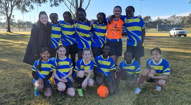 Students posing after playing soccer for Our Lady of the Rosary Catholic Primary School St Marys