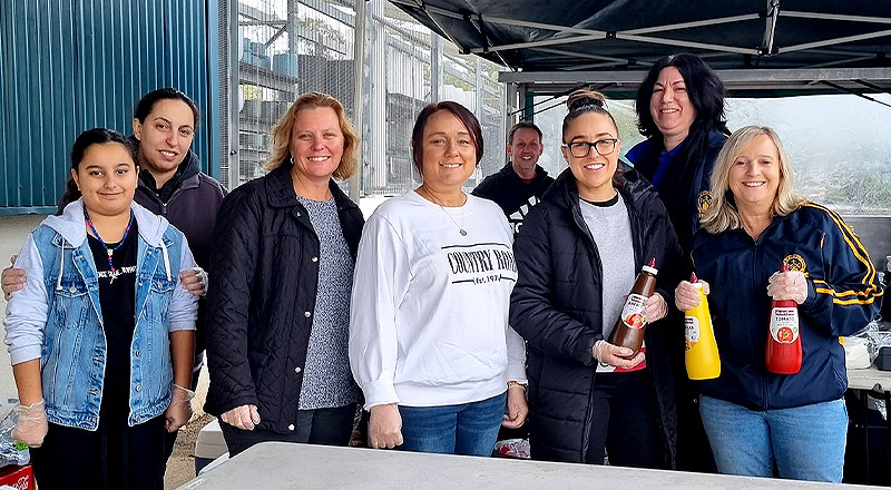 Parents and students at sausage sizzle at Our Lady of the Rosary Catholic Primary School St Marys