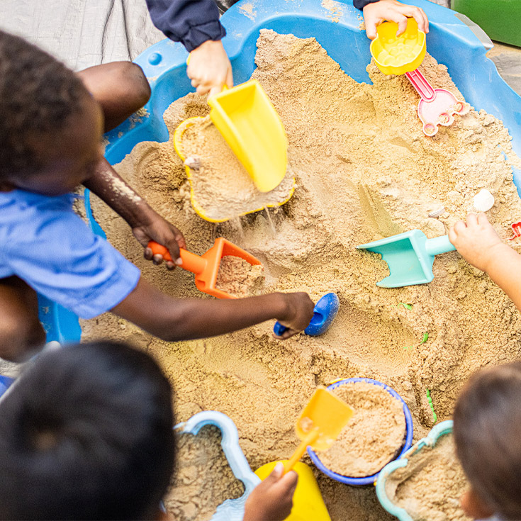 Children playing in sandpit at Our Lady of the Rosary Catholic Primary School St Marys