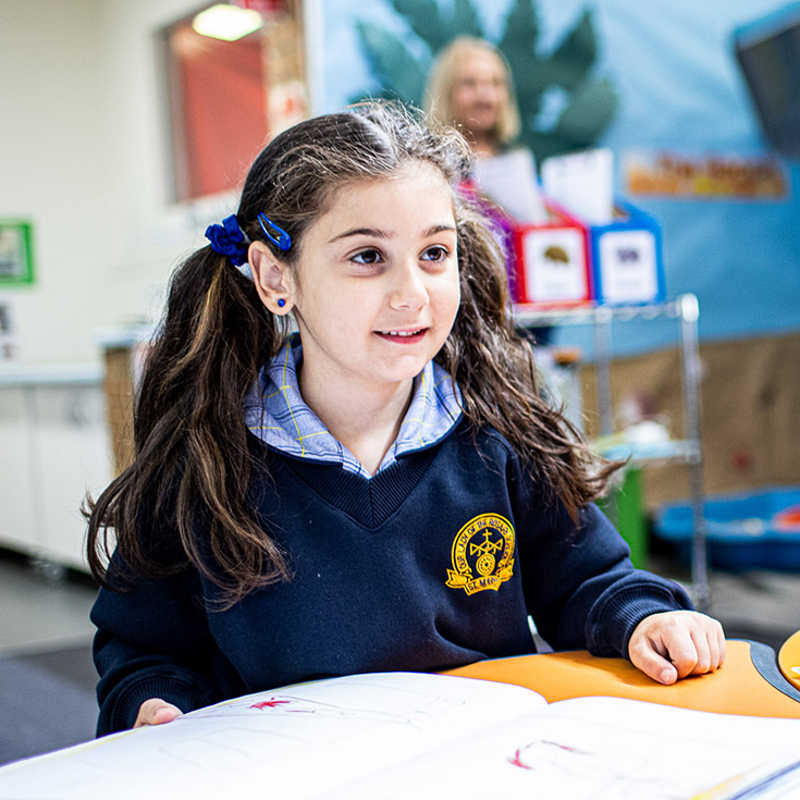 Child smiling at Our Lady of the Rosary Catholic Primary School St Marys