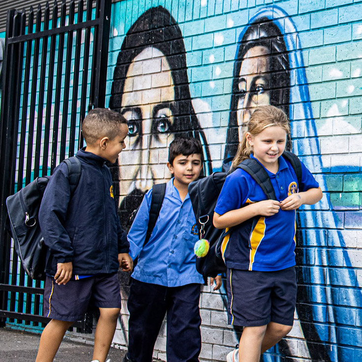 Students walking past mural at Our Lady of the Rosary Catholic Primary School St Marys