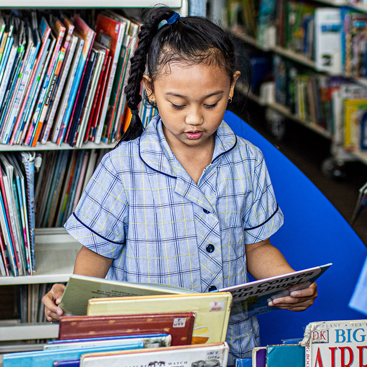 Student reading at Our Lady of the Rosary Catholic Primary School St Marys