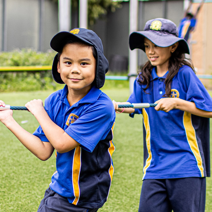 Smiling students on school play equipment at Our Lady of the Rosary Catholic Primary School St Marys